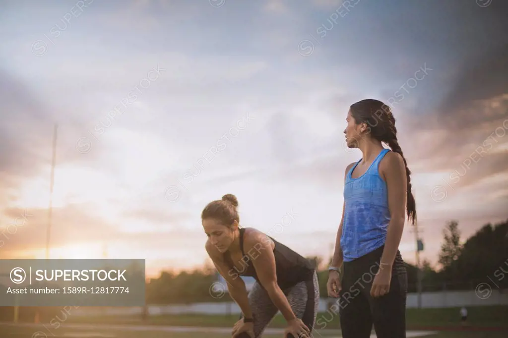 Athletes resting on sports field