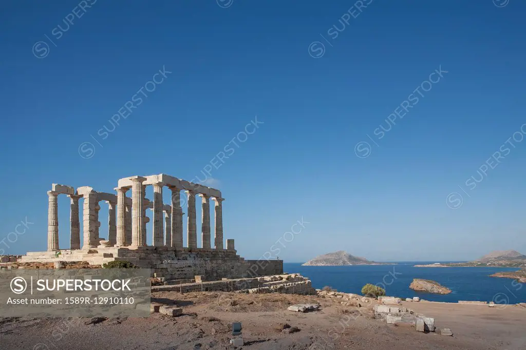 Temple of Poseidon ruins under blue sky, Cap Sunion, Greece