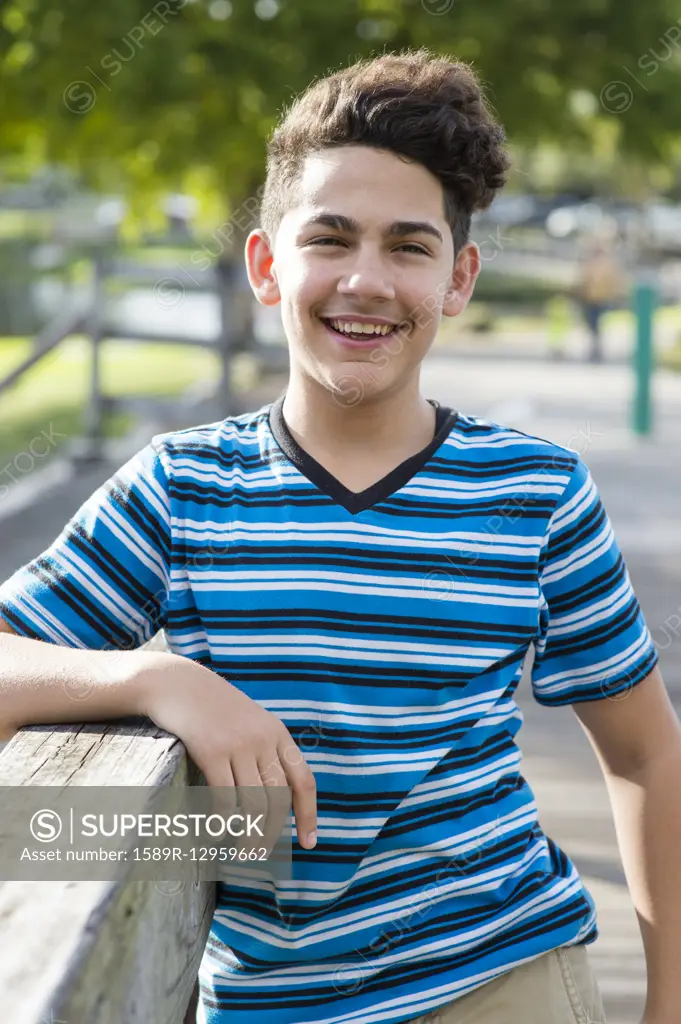 Hispanic boy smiling outdoors