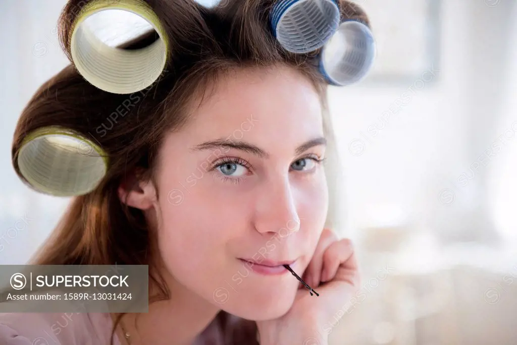 Native American woman with curlers in hair