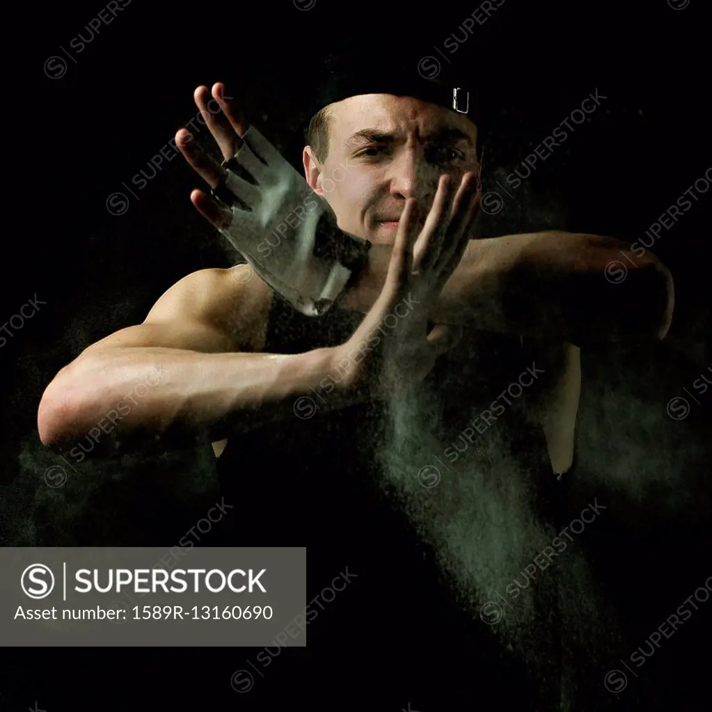 Caucasian man flexing muscles