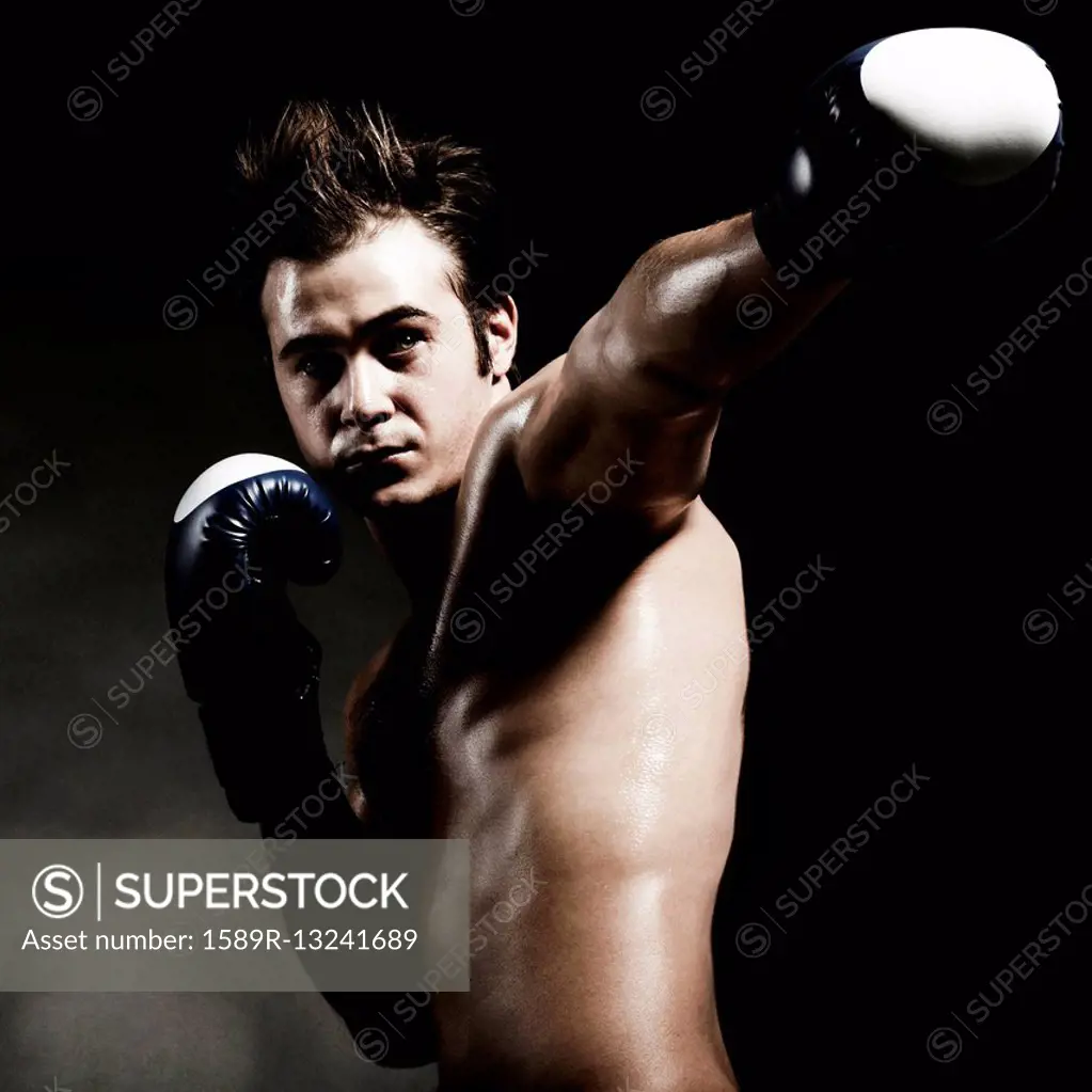 Low angle view of Caucasian boxer punching