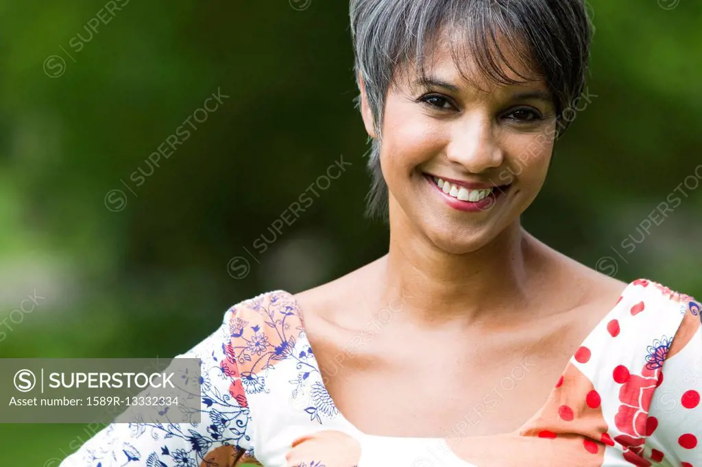 Smiling mixed race woman