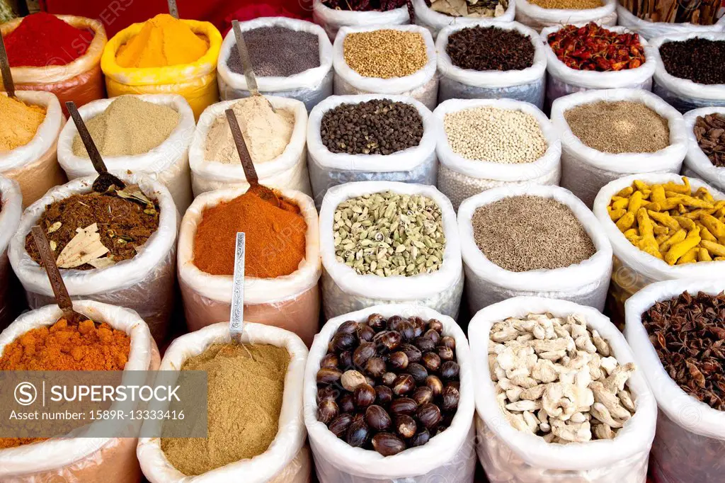 Variety of colorful Indian spices in sacks