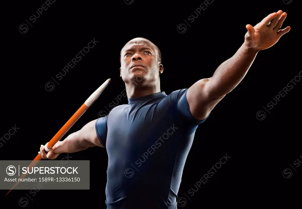 African American man holding track and field javelin