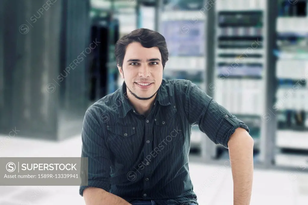 Hispanic businessman in server room