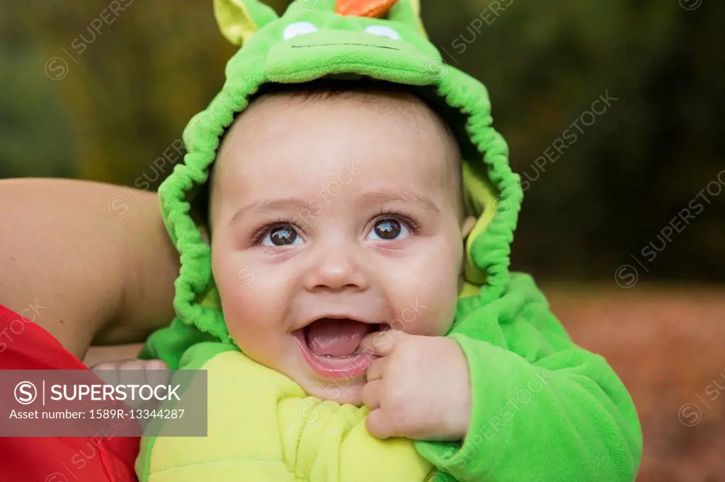 Smiling baby wearing costume