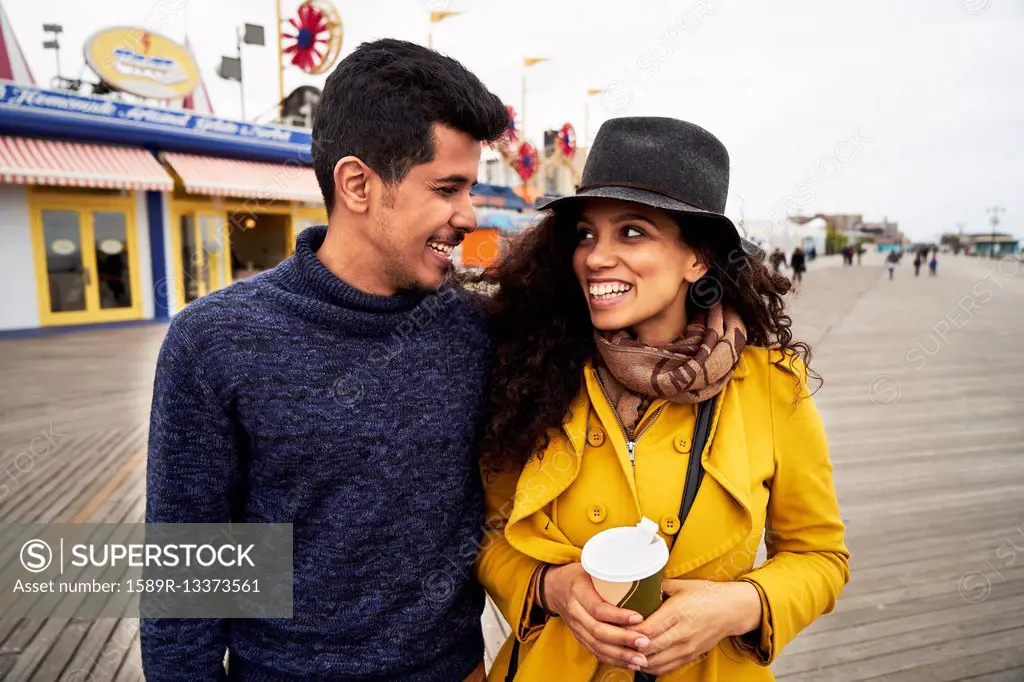 Couple on boardwalk at amusement park