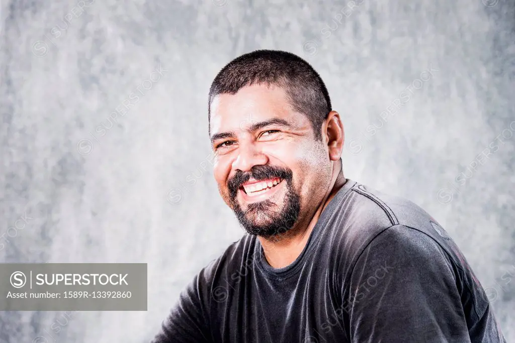 Close up of smiling Hispanic man