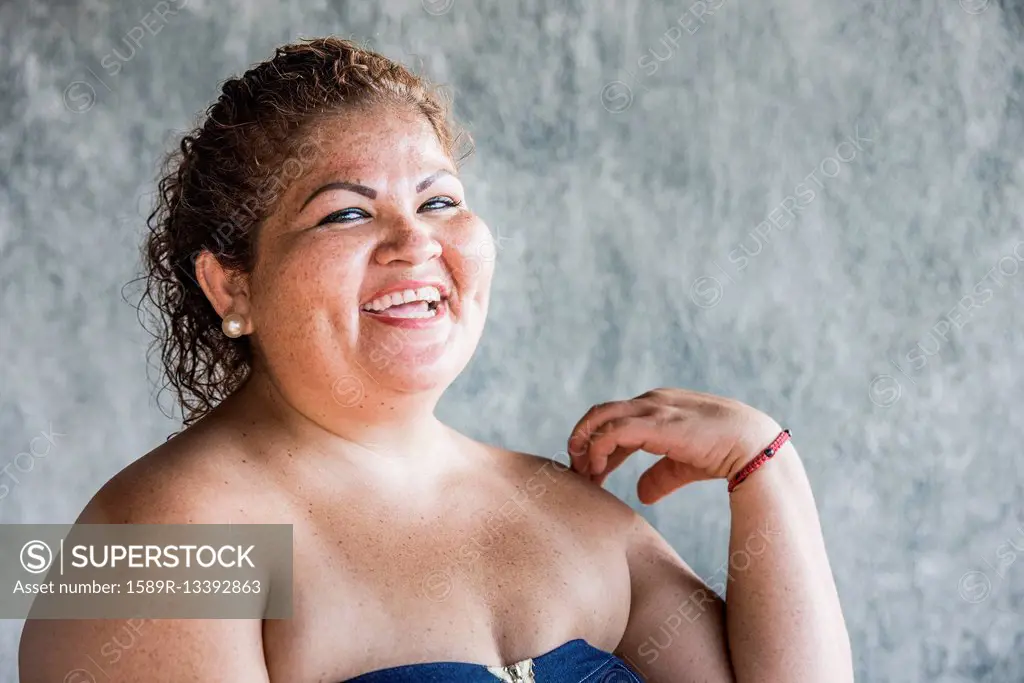 Close up of laughing Hispanic woman