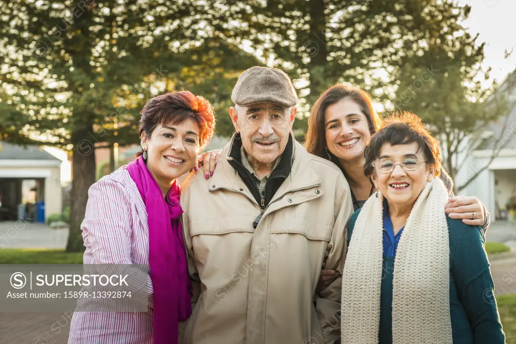 Hispanic Multi-generation family smiling outdoors