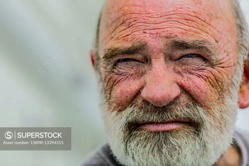 Close up of wrinkled face of Caucasian man