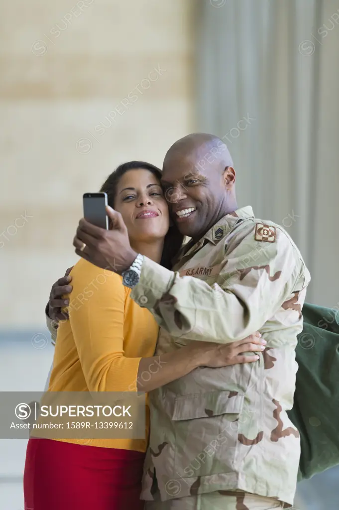 African American soldier and wife taking selfie