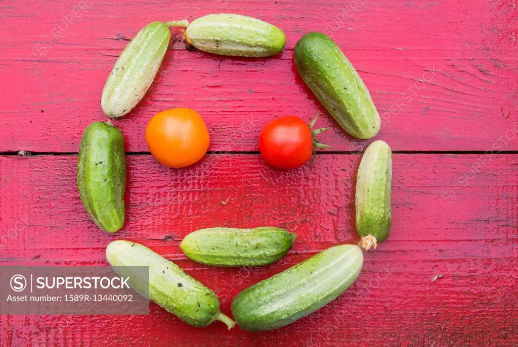 Cucumbers and tomatoes arranged in smiley face