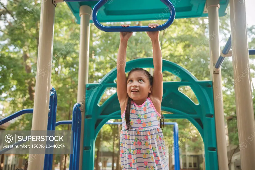 Hispanic playing on playground