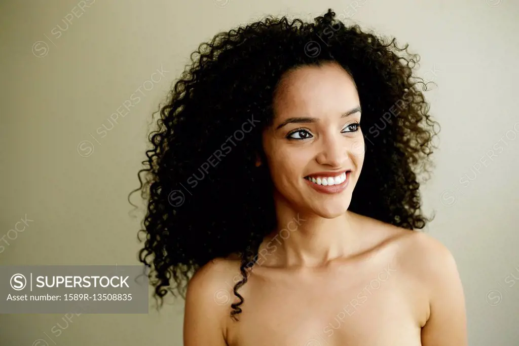 Portrait of smiling Hispanic woman looking away