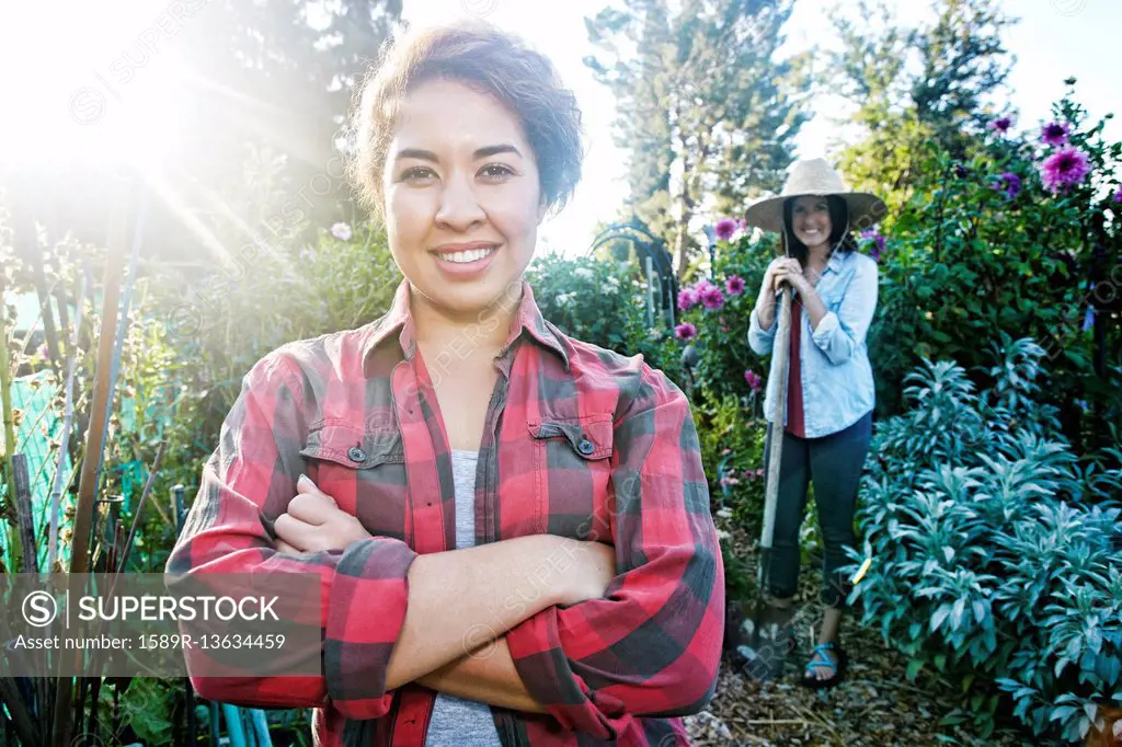 Smiling women posing in garden