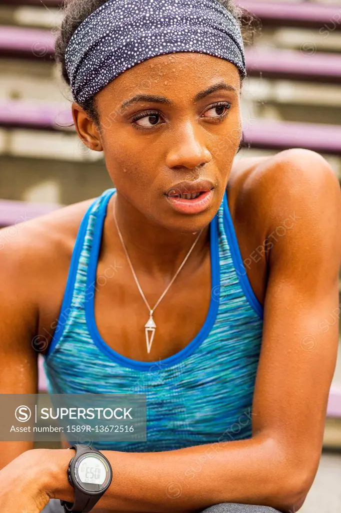 Serious Black athlete sweating