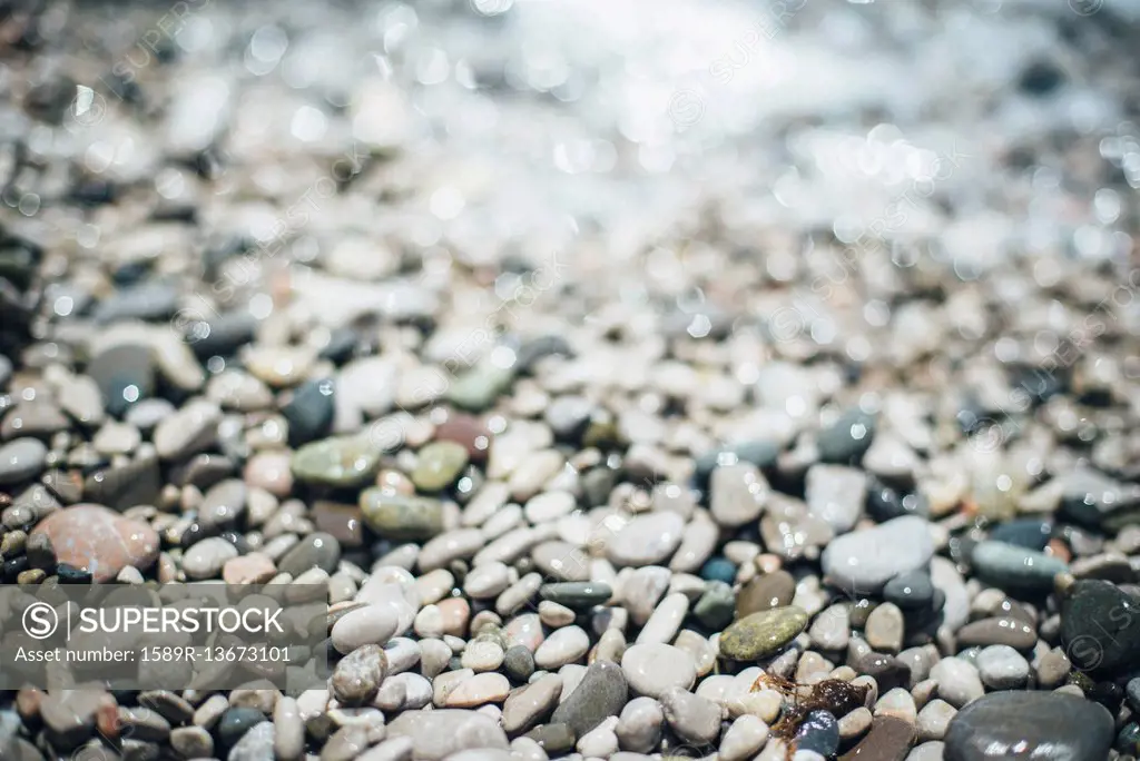 Wet pebbles at beach