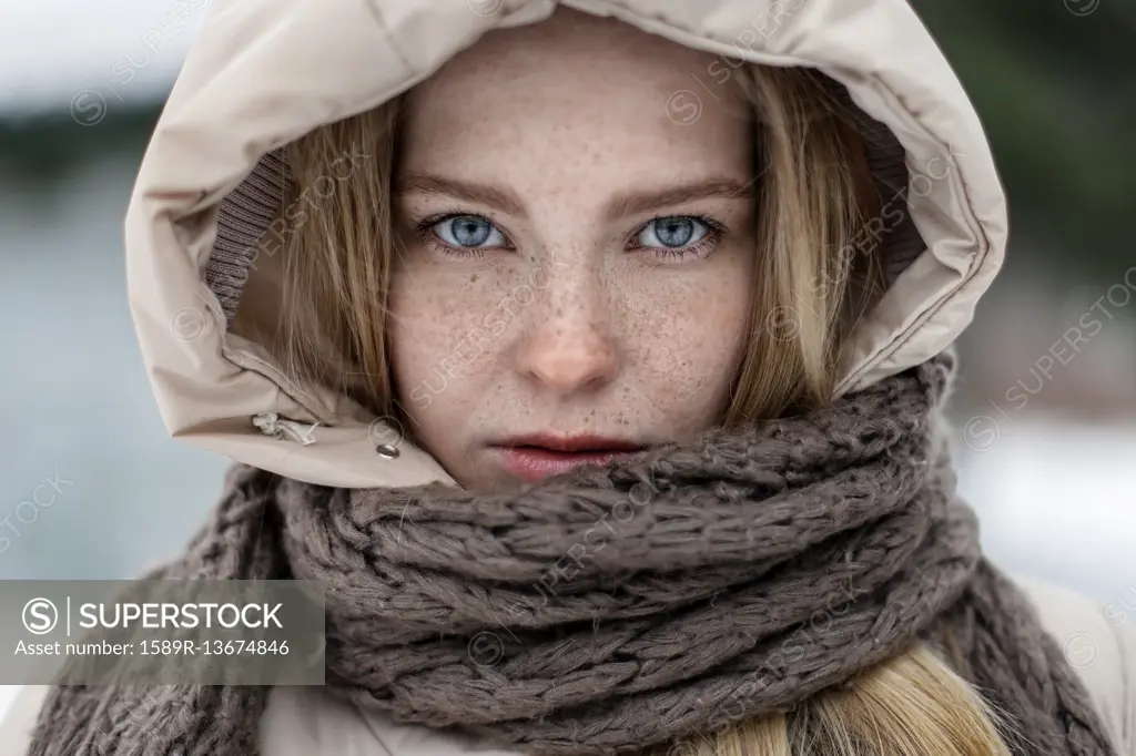 Caucasian woman wearing hood and scarf