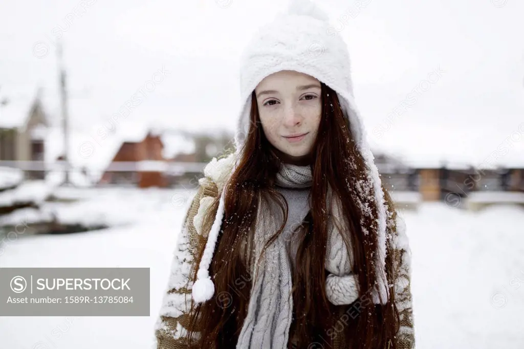 Portrait of Caucasian girl outdoors in snow