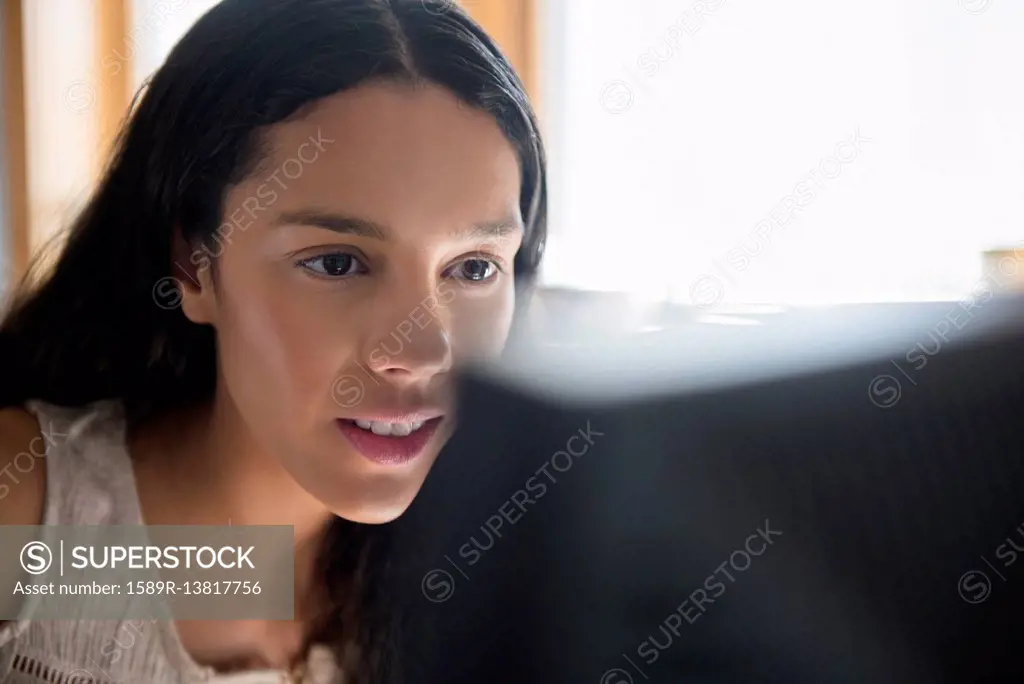 Hispanic woman using computer