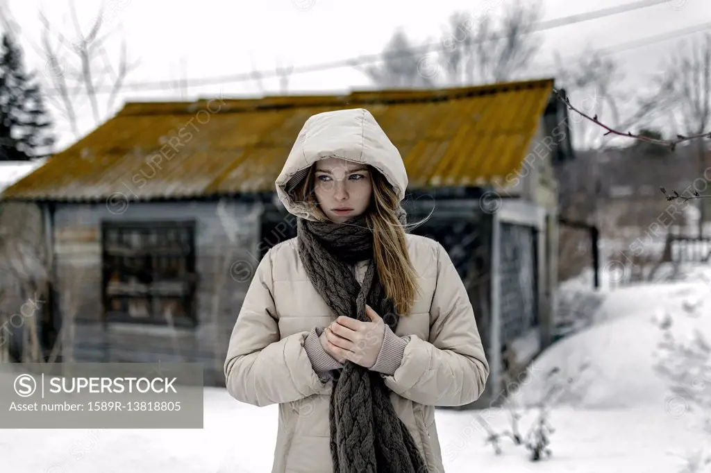 Caucasian woman wearing coat and scarf in winter