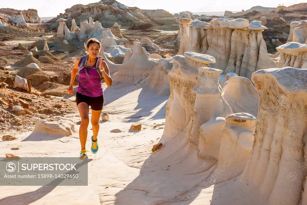 Native American woman running in desert