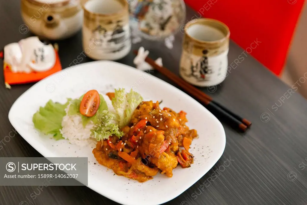 Chopsticks near plate of food