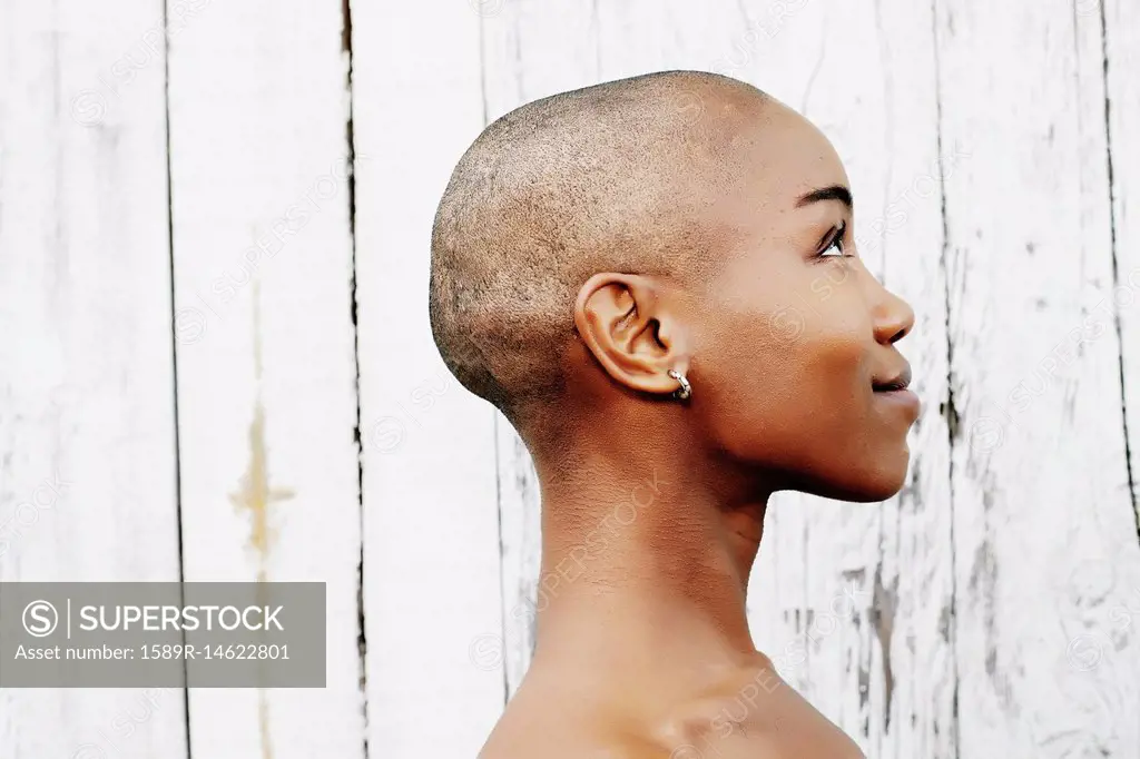 Profile of naked bald black woman