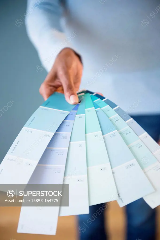 Cape Verdean woman holding color swatches