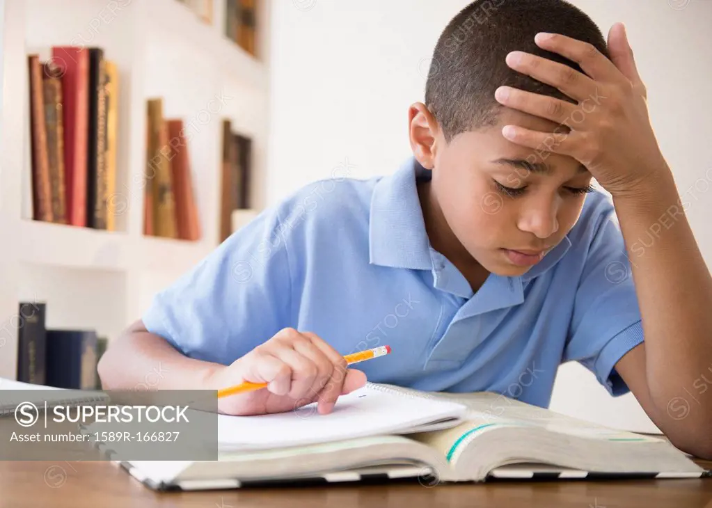 Hispanic boy doing homework