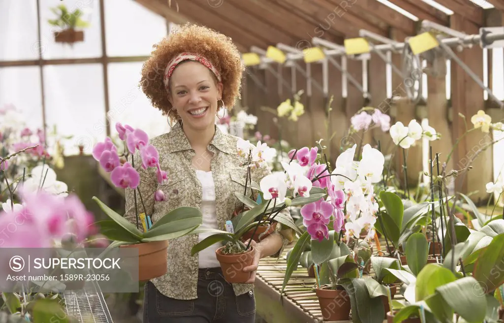 African American woman in greenhouse