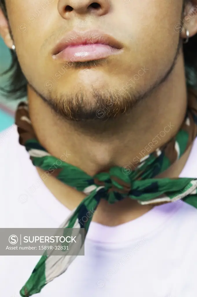 Close up of bandana around young Hispanic mans neck