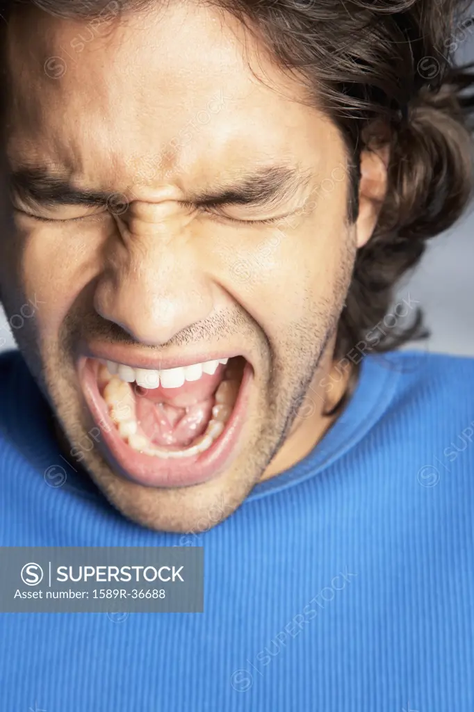 Close up of Hispanic man yelling