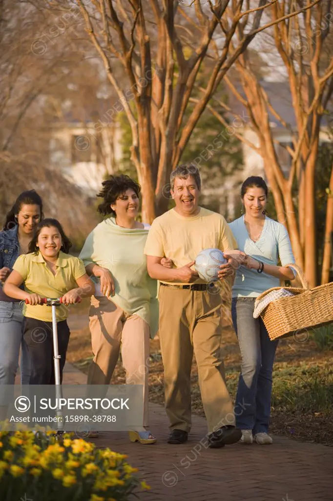 Hispanic family walking in park