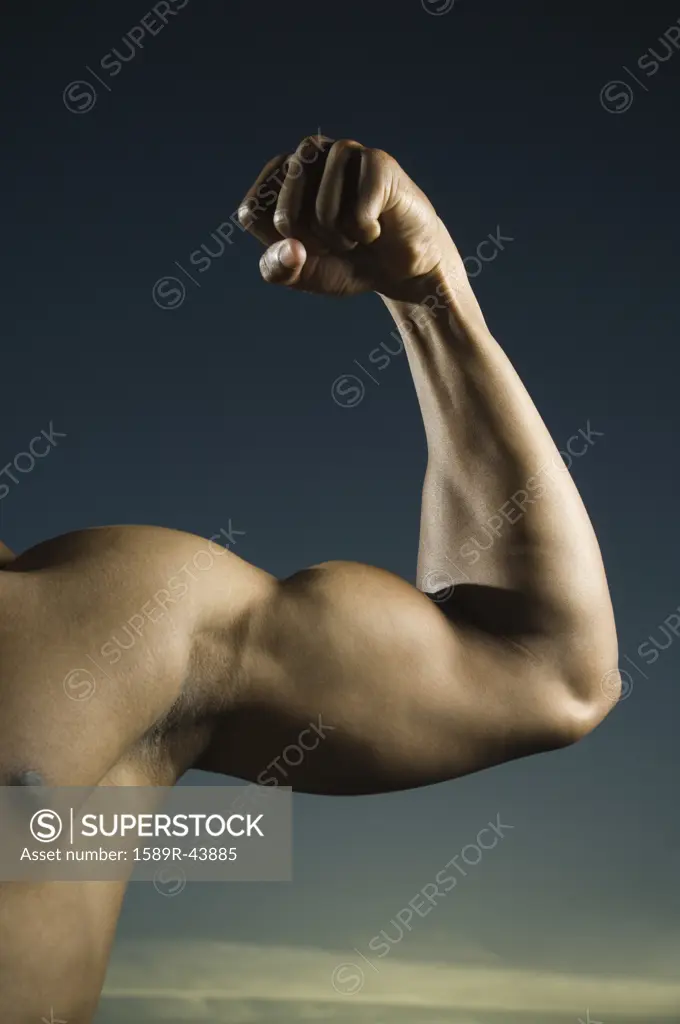 African American man flexing biceps