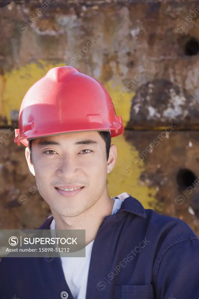 Men at work with hard hats - SuperStock