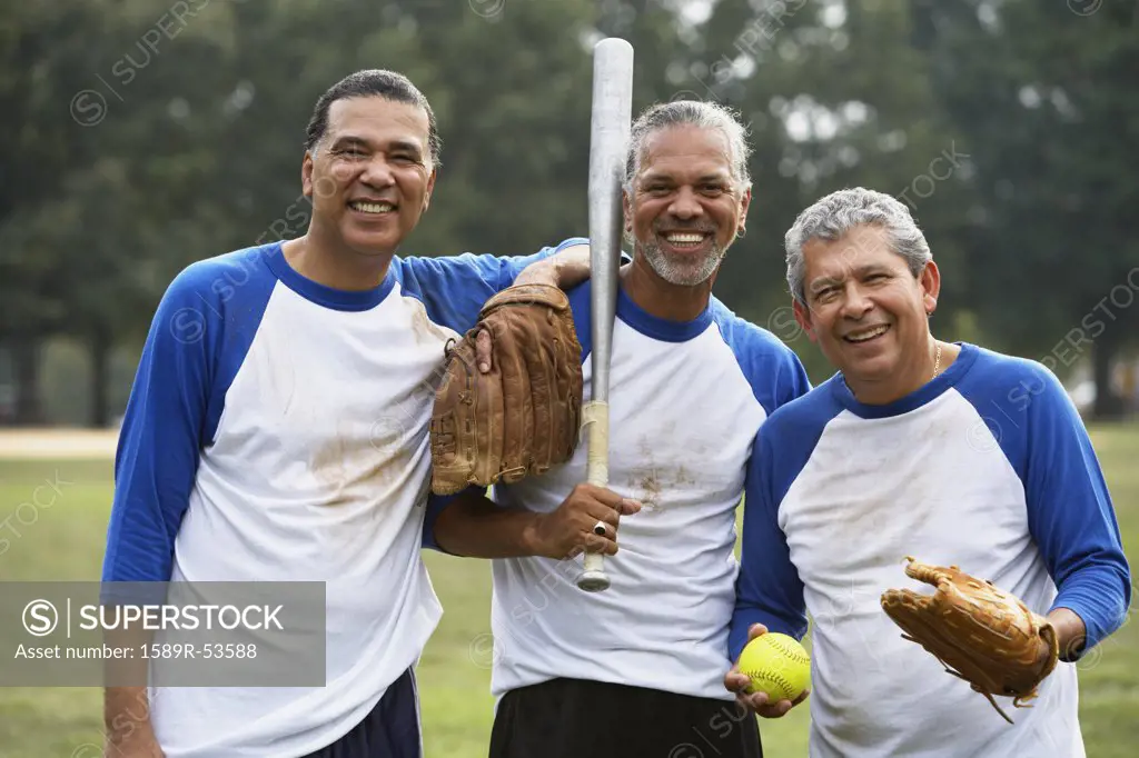 Multi-ethnic men with baseball gear