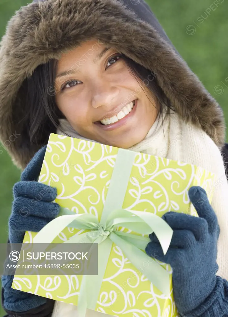 Pacific Islander woman holding gift