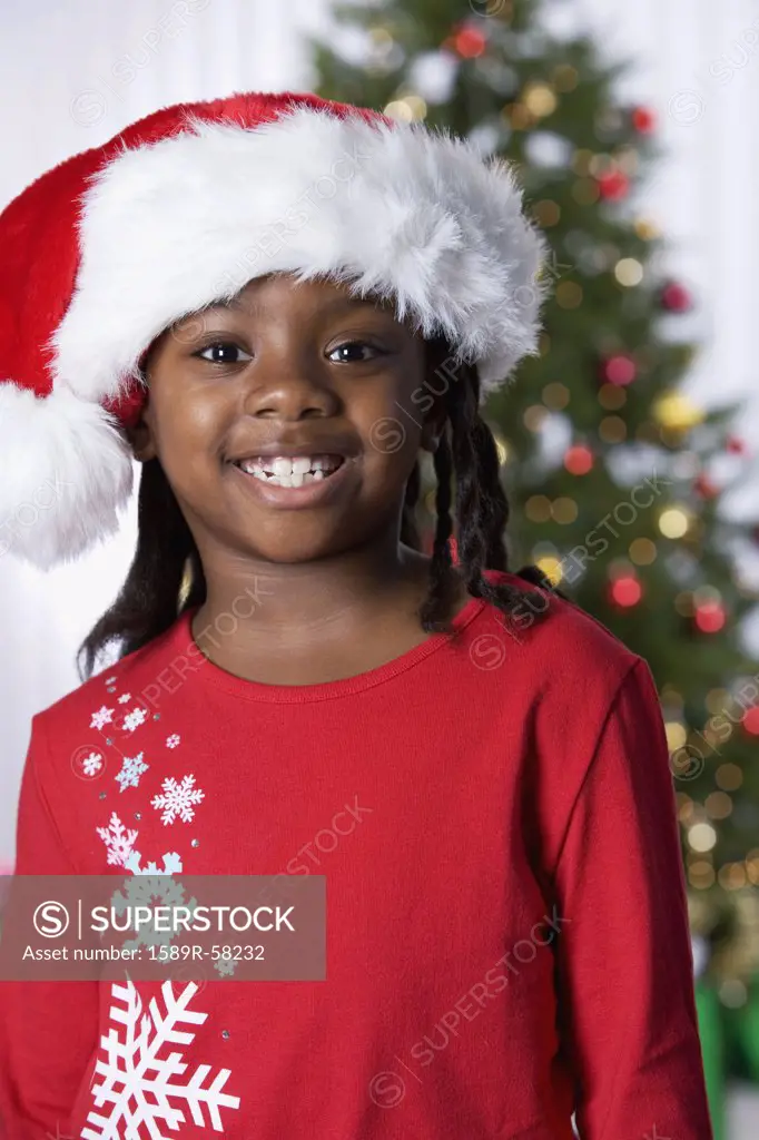 African girl wearing Santa Claus hat