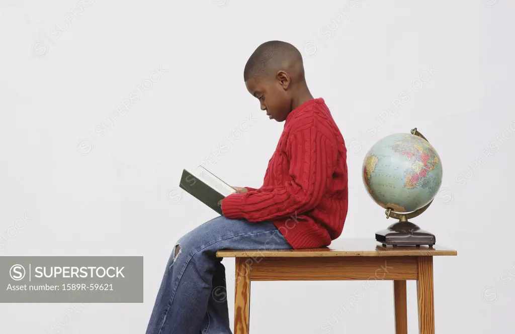 African boy reading book