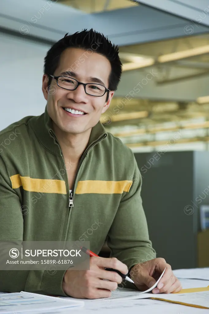 Asian American businessman working in office