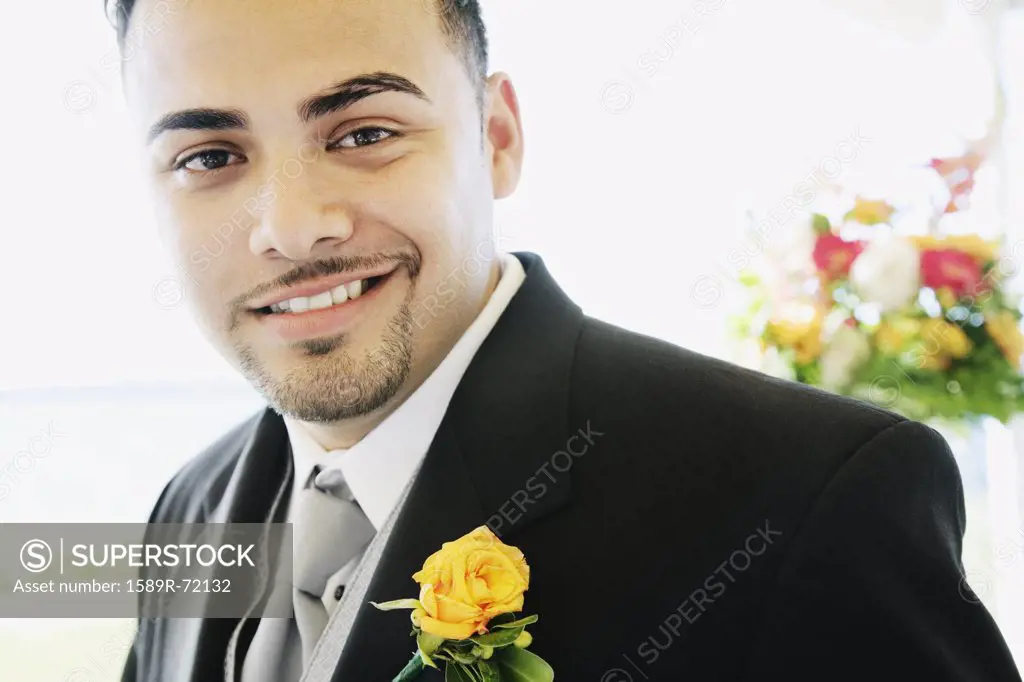 Hispanic man wearing tuxedo