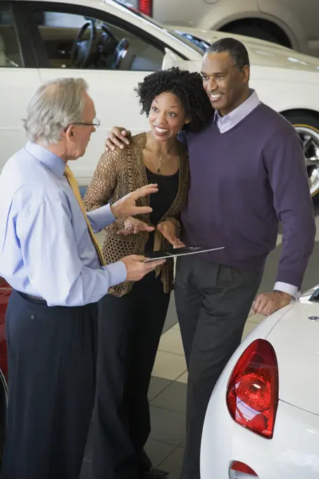 Couple buying a car