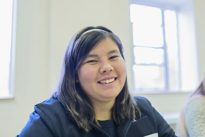 Native American student smiling in class