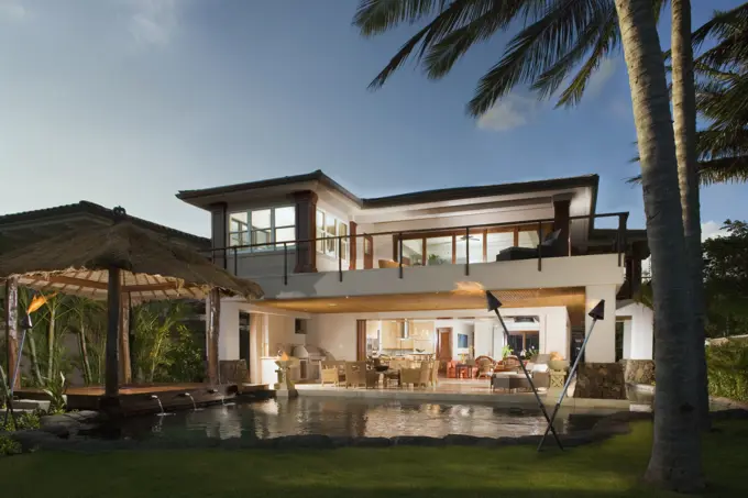 Modern Hawaiian home with pocket doors and wrap around balcony