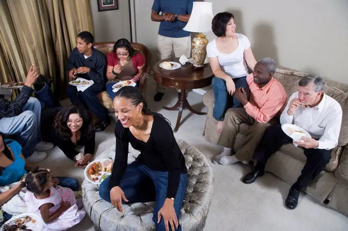 Multi-generation family relaxing together in living room