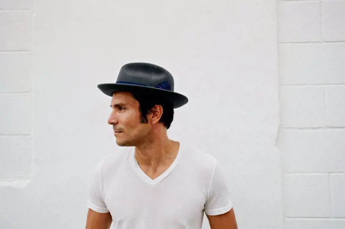 Mixed race man wearing hat outdoors