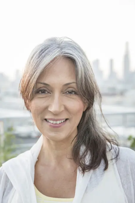 Older mixed race woman smiling